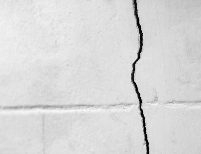 Ugly cracks got you down? Learn to fix them yourself with this UK homeowner's guide. DIY home repairs External wall cracks UK homes Masonry repair Maintenance tips
